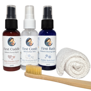 Three Moon & Milk Dolls reborn care sprays with a bamboo brush and white lint-free cloth arranged on a clean background.