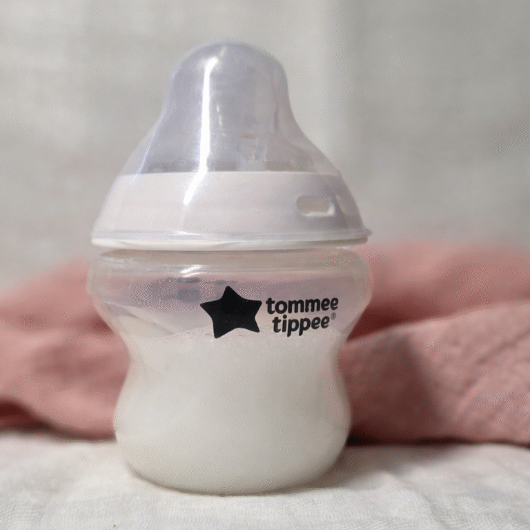 Realistic fake formula bottle for reborn dolls on soft fabric background